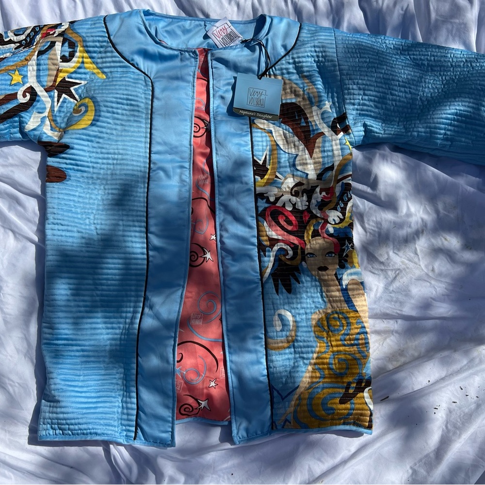 1980s Light blue quilted showgirl print with salmon pink inside detailing